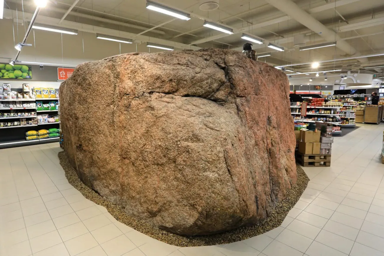 A glacial boulder left in place inside the Viimsi Selver supermarket, with the shop built around it